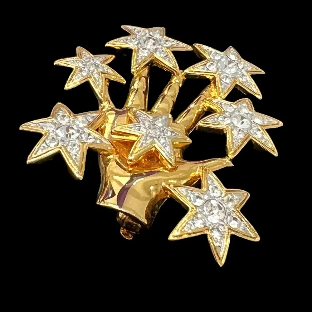 NOLAN MILLER SHINY GOLDEN HAND WITH CRYSTAL STARS BROOCH